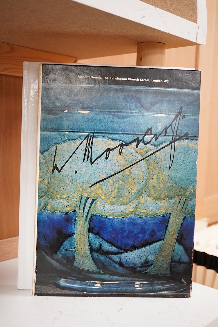 A Moorcroft for Liberty & Co. Flamminion Ware vase, and a smaller Moorcroft vase glazed in a mottled plum flambe, the first 20cm., also to include two Moorcroft reference books